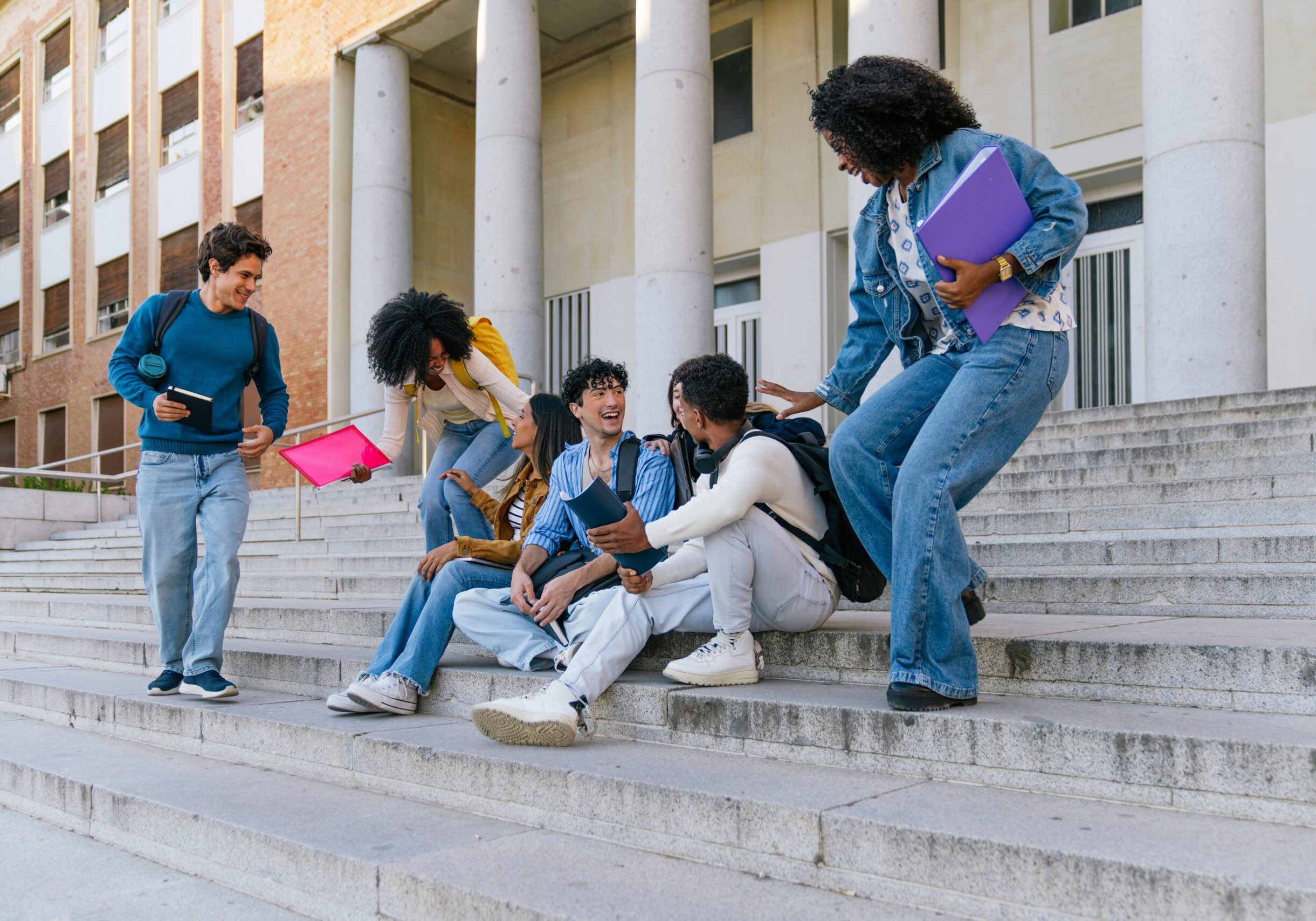 Students walking through a college campus hallway highlighting the importance of active shooter training and campus safety